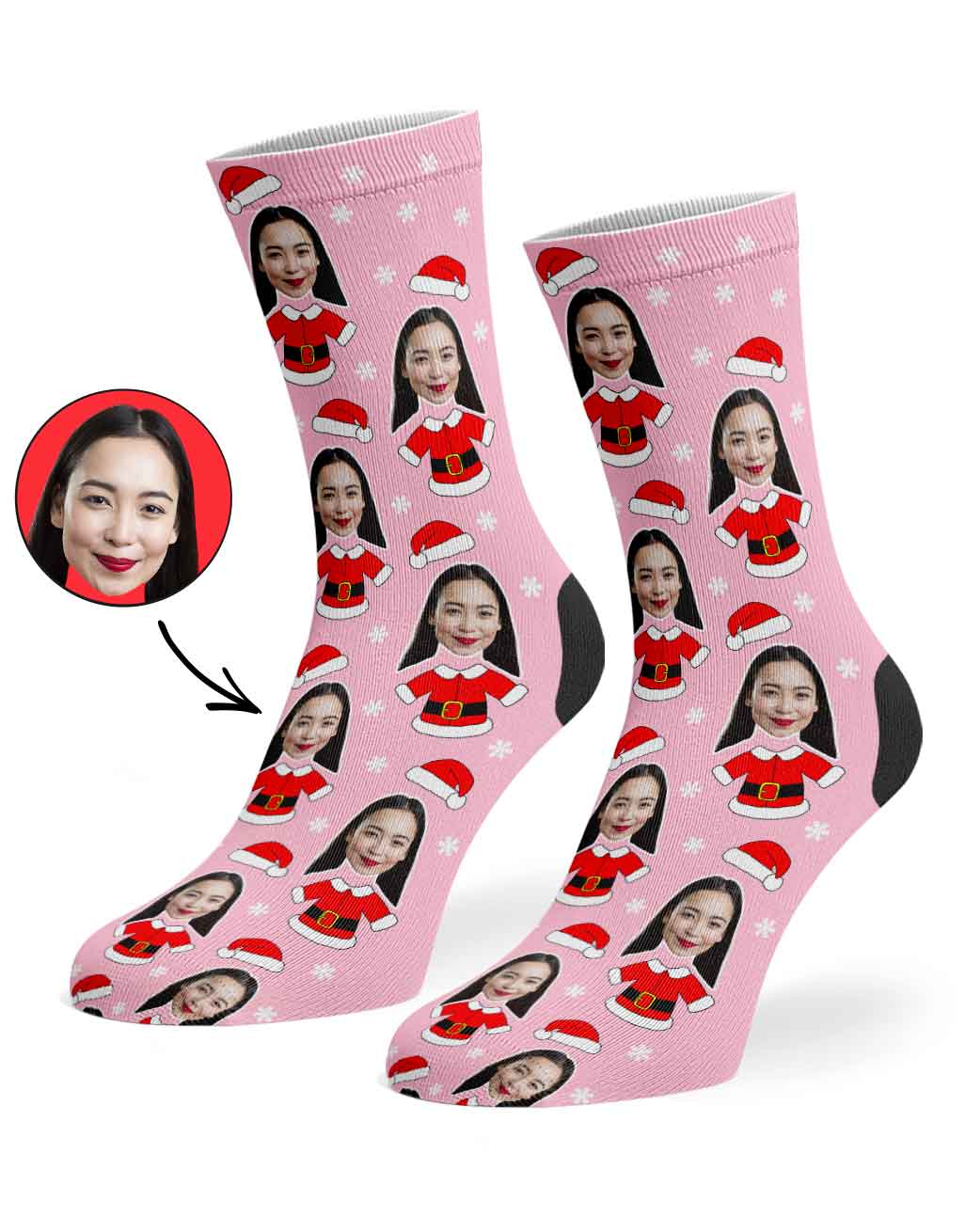 Pink socks with a face printed design on a white background
