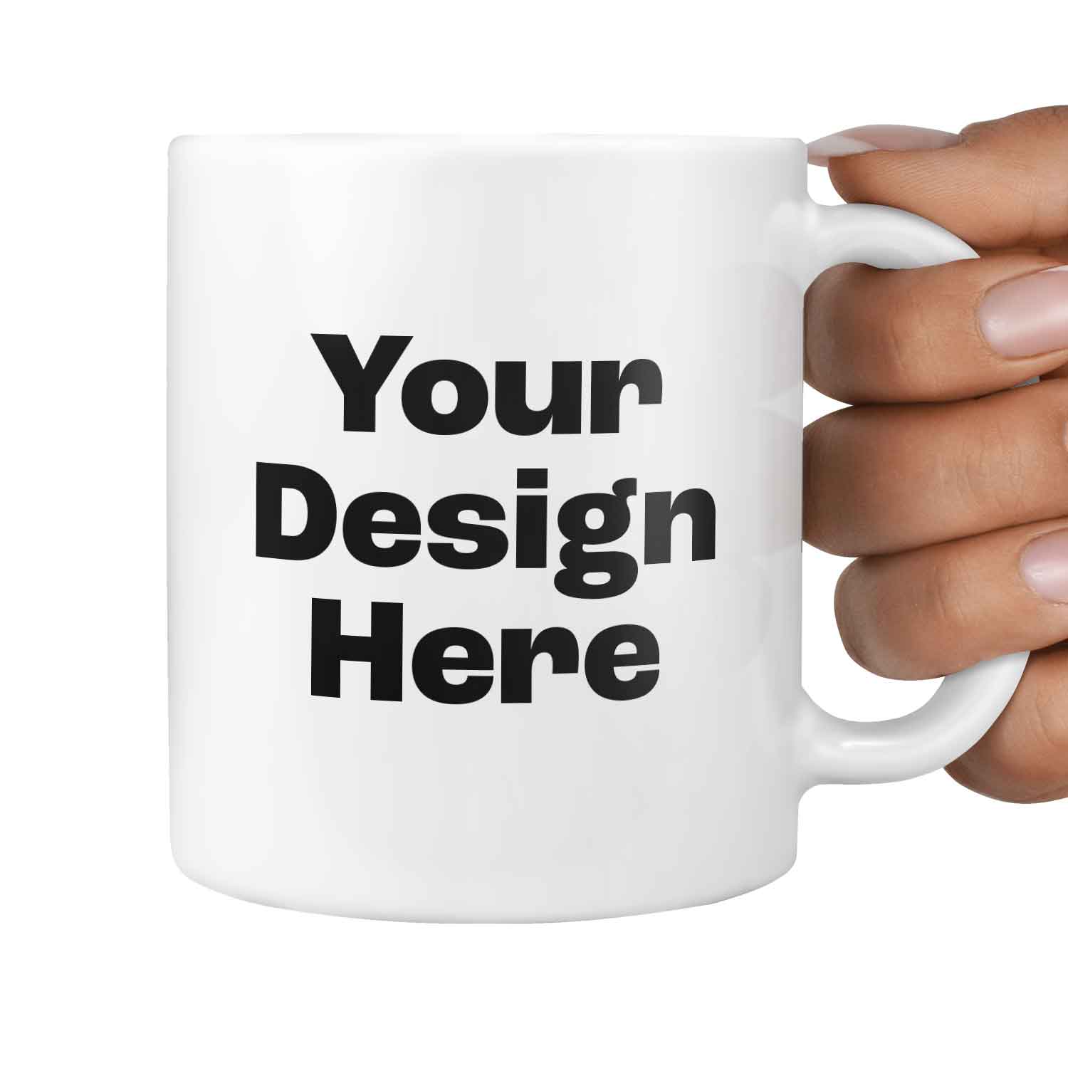 White mug with 'Your Design Here' text held by a hand on a white background